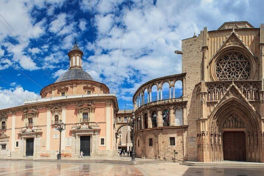 A historic building with a dome and a Gothic-style tower. 2
