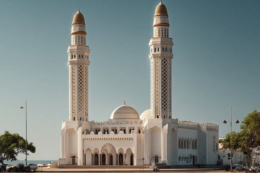 A large mosque with two tall minarets and a central dome. 5