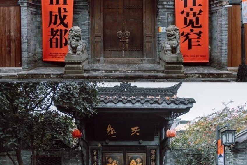 A traditional Chinese building with red banners and stone lion statues at the entrance. 5