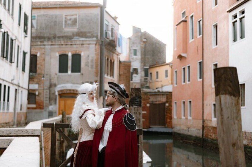 A narrow Venetian canal with buildings on either side. 1