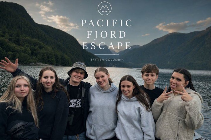 A group of people by a lake with mountains in the background, labeled 'Pacific Fjord Escape British Columbia.' 2
