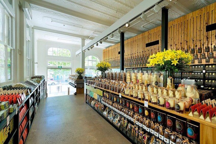 A store interior with shelves of dried flowers and other items. 4