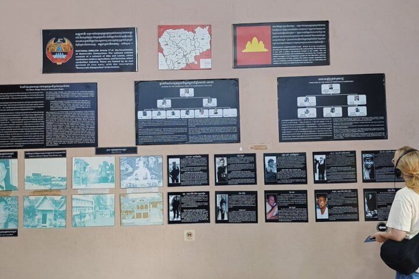 A wall with multiple informational panels, including text and images, likely in a museum or exhibition setting. 5