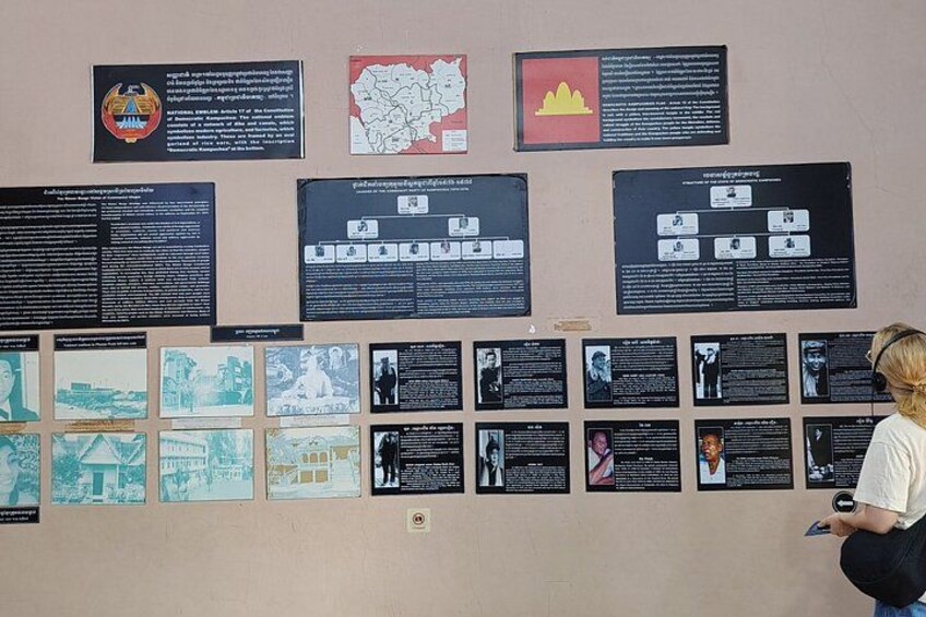 A wall with multiple informational panels, some with text and others with images. 5