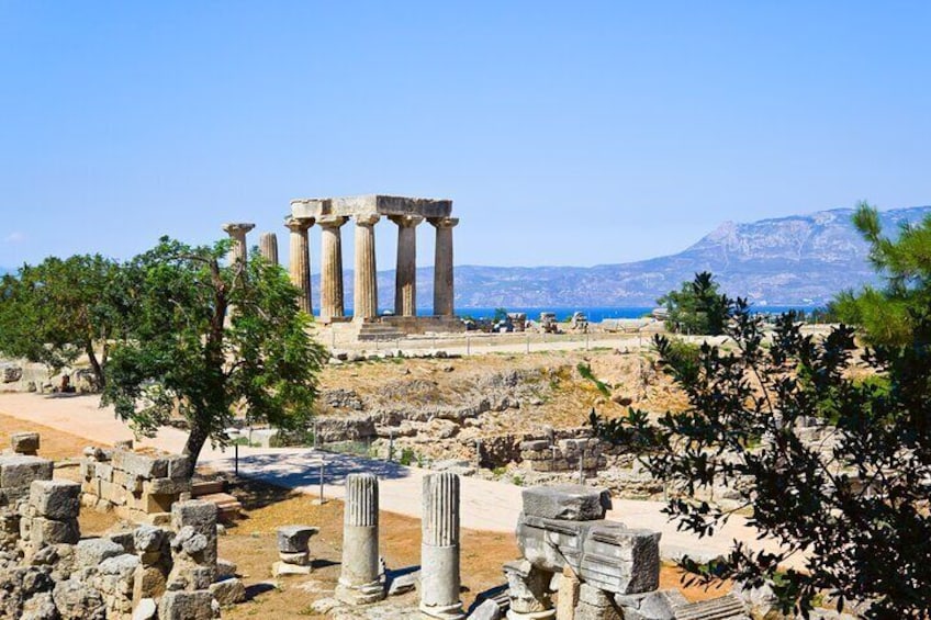 Ancient ruins with columns, a clear sky, and a mountain in the background. 5