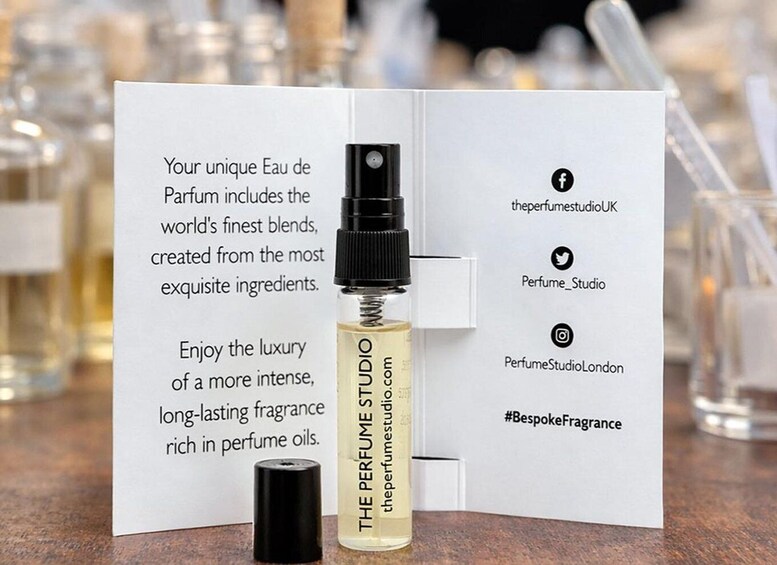 A perfume bottle labeled 'THE PERFUME STUDIO' with a card describing its unique Eau de Parfum. 5