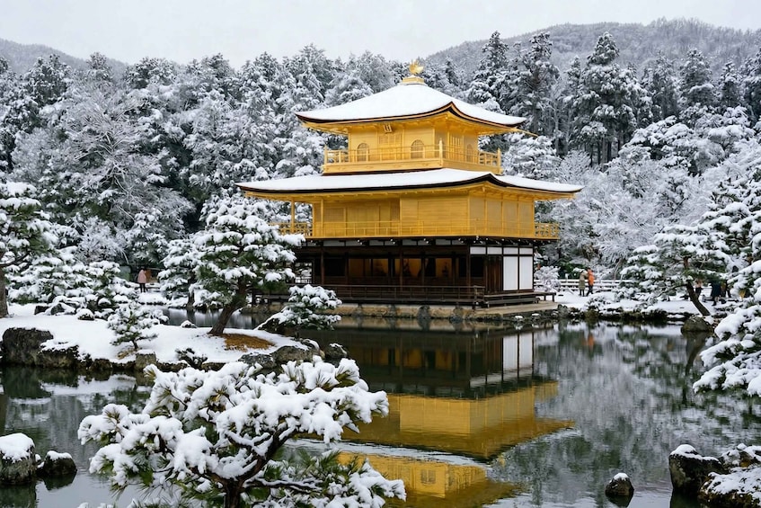 A snow-covered pagoda with a reflection in a pond, surrounded by snow-laden trees. 3