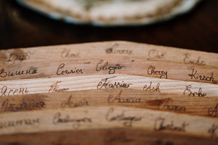 A wooden surface with handwritten text, possibly a menu or list. 4
