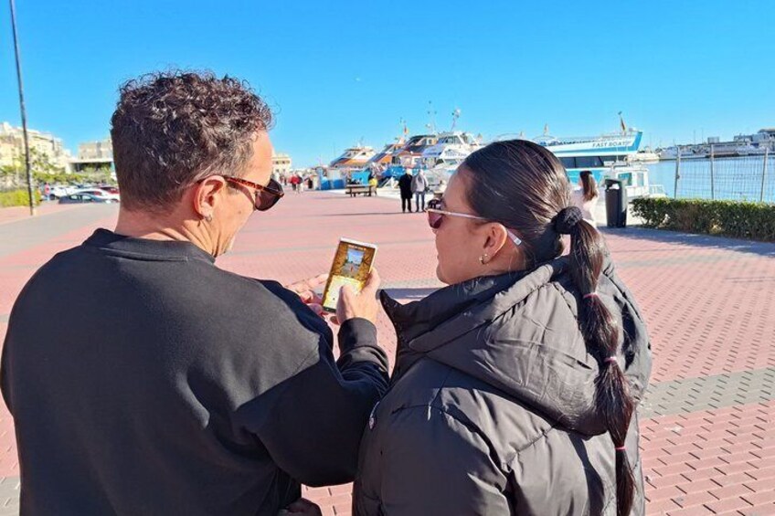 Two people taking a photo with a smartphone. 4
