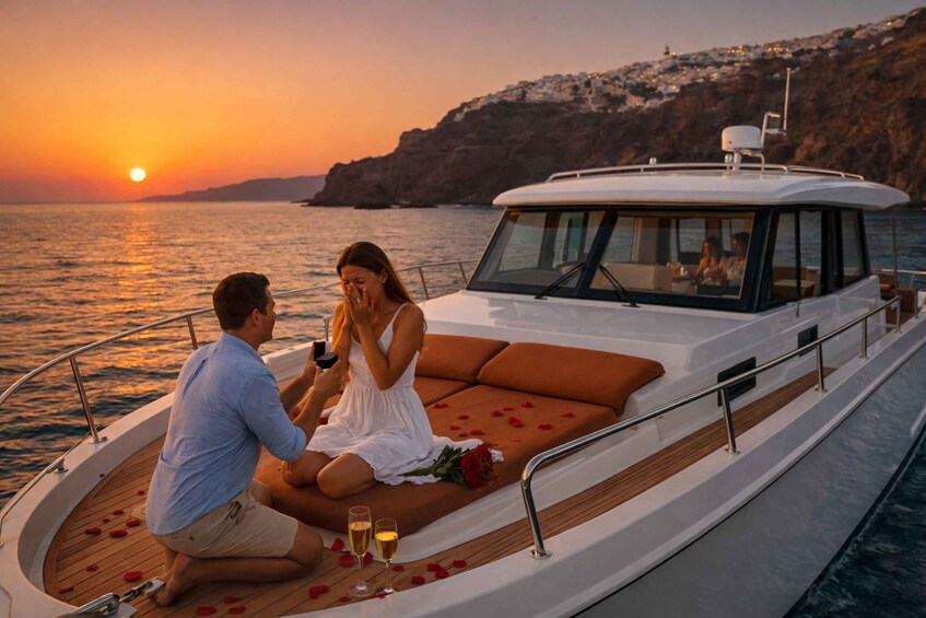 A couple on a boat at sunset with a cliff in the background. 1