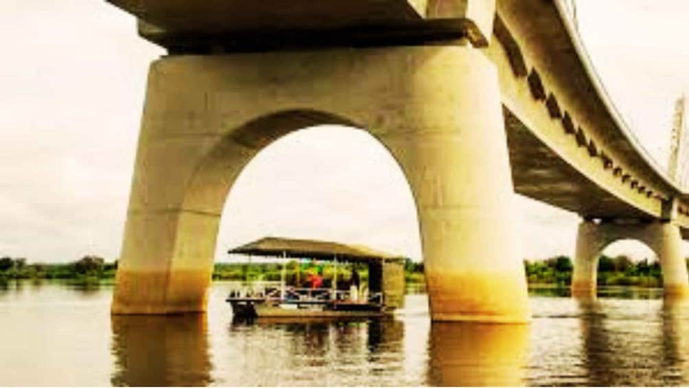 A bridge with a boat docked underneath. 3