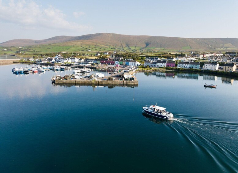 A coastal town with a harbor, boats, and colorful buildings. 4