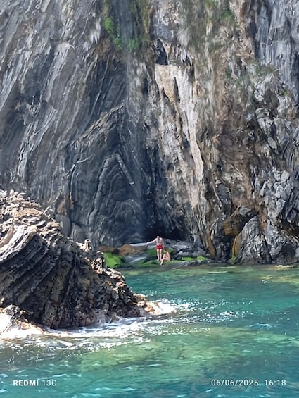 A rocky coastal landscape with clear turquoise water. 3