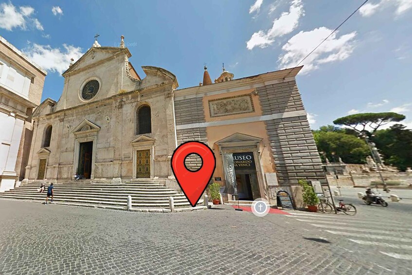 A historic church with a bell tower and a museum entrance. 2