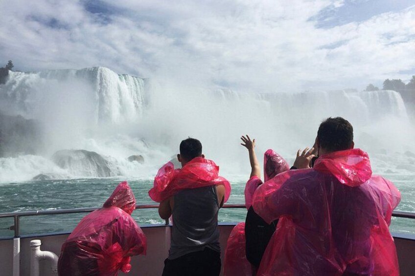 People on a boat observing a waterfall. 2