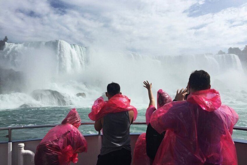 People on a boat observing a waterfall. 2