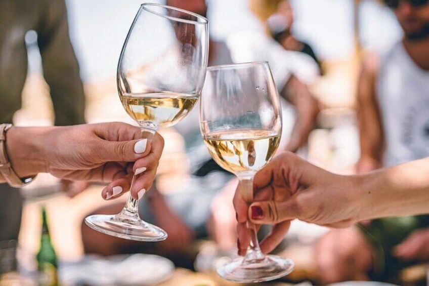Two hands holding wine glasses. 3
