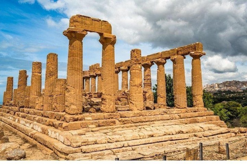 Ancient ruins with columns and stone steps. 1