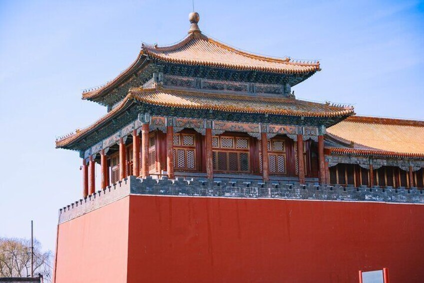 A traditional Chinese building with ornate architecture, including a multi-tiered roof and intricate wooden carvings. 1