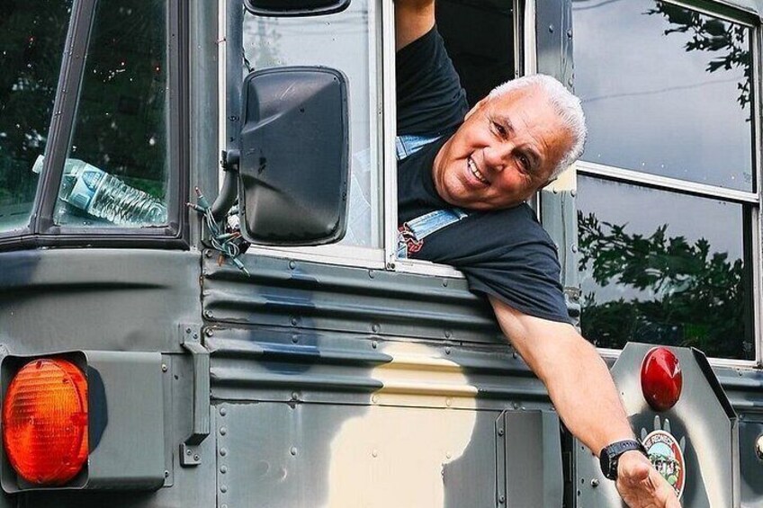 A person leaning out of a vehicle window. 2