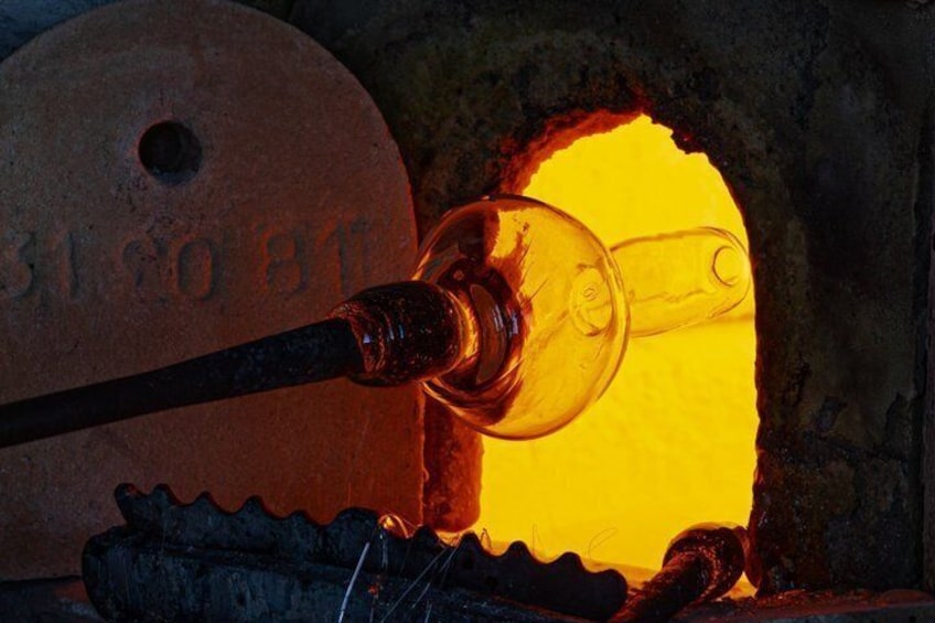 A glass blowing process with a furnace and a blowpipe. 4