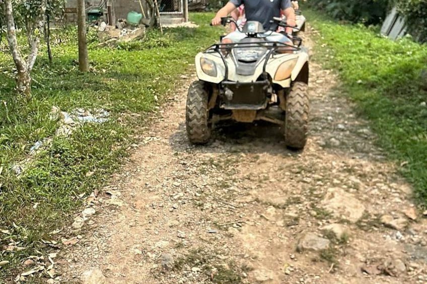 A dirt path with an ATV. 2