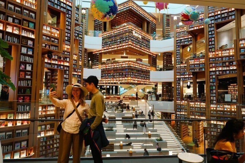 A multi-level bookstore with bookshelves on multiple floors and a central atrium. 5