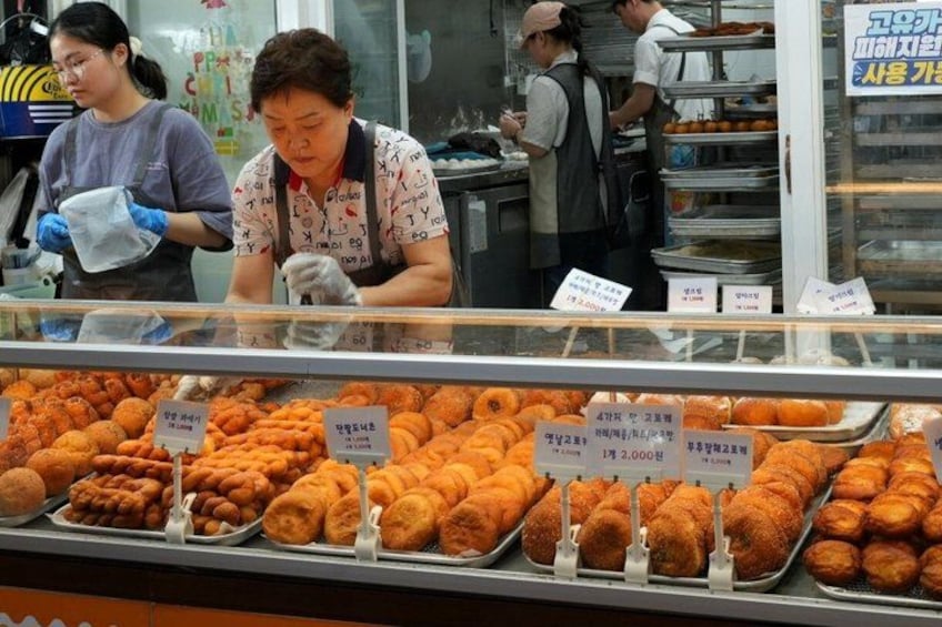 A bakery display with various baked goods. 5
