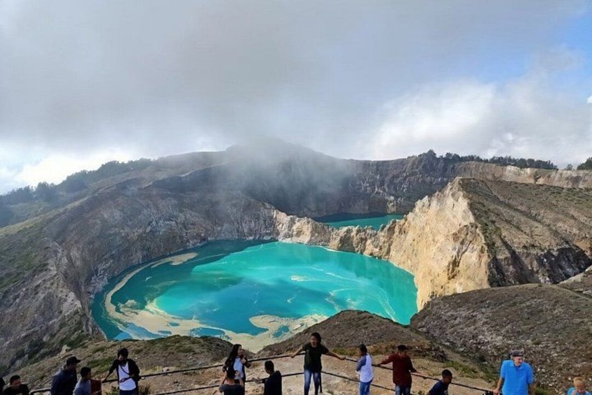 A large crater lake surrounded by rugged terrain. 1