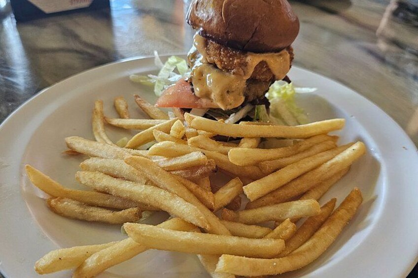 A plate with a burger and French fries. 2