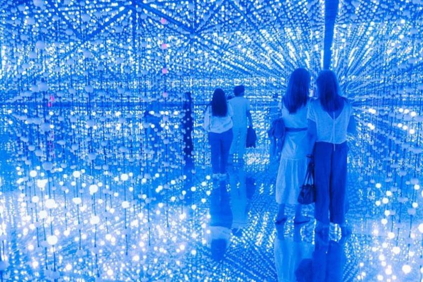 A tunnel of blue lights with people walking through. 5