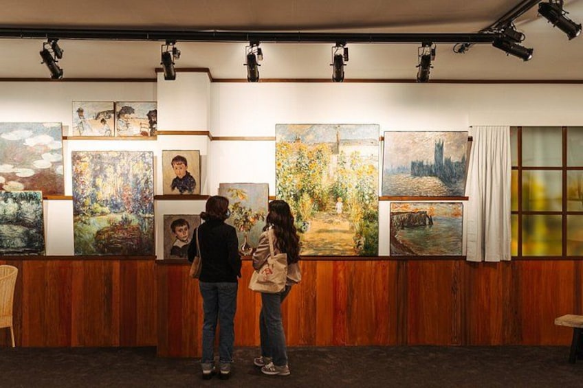 An art gallery with paintings on display. 2