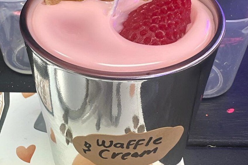 A waffle cream cup with a strawberry on top. 2