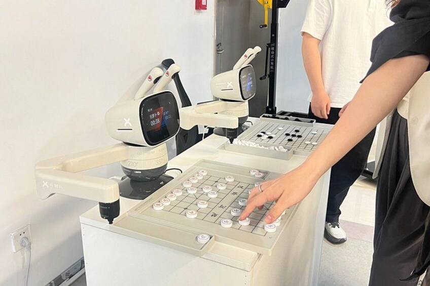 A medical examination setup with a patient lying on a table, a digital display, and a control panel. 2