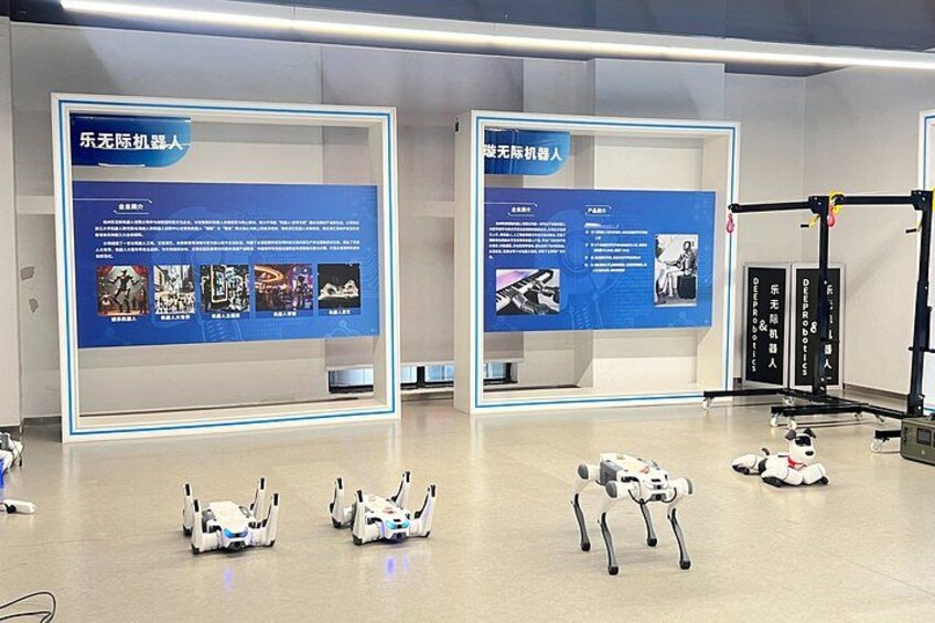 A robotics lab with humanoid robots and informational displays. 4