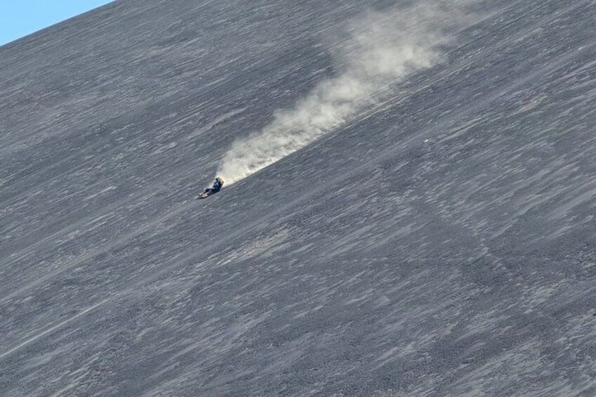A person skiing down a steep, snow-covered slope. 5