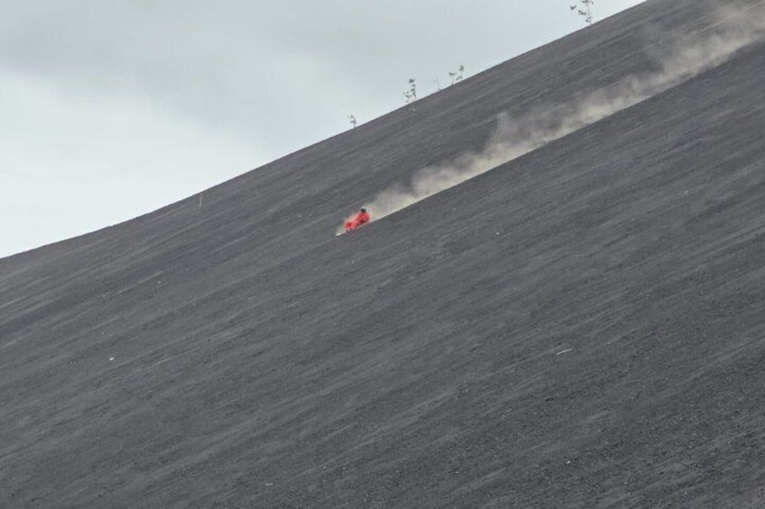 A vehicle descending a steep, unpaved slope. 4