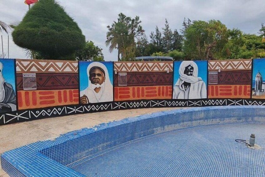 A swimming pool with a mural of a person in traditional attire. 2