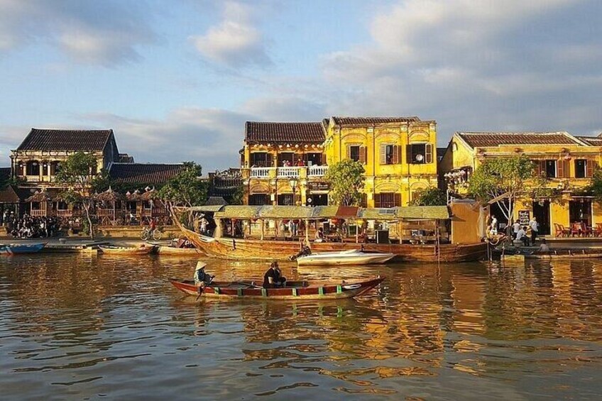 A riverside town with traditional buildings and boats. 3