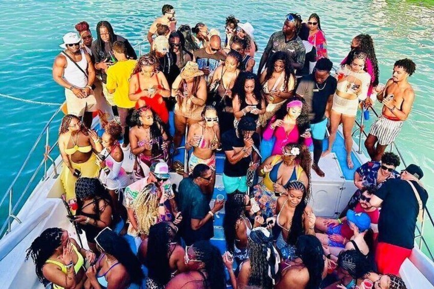 A group of people on a boat in a body of water. 1