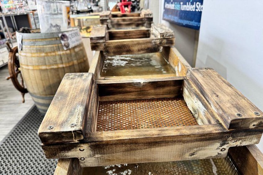 Wooden tubs with water, likely for soaking or washing, in a store setting. 2