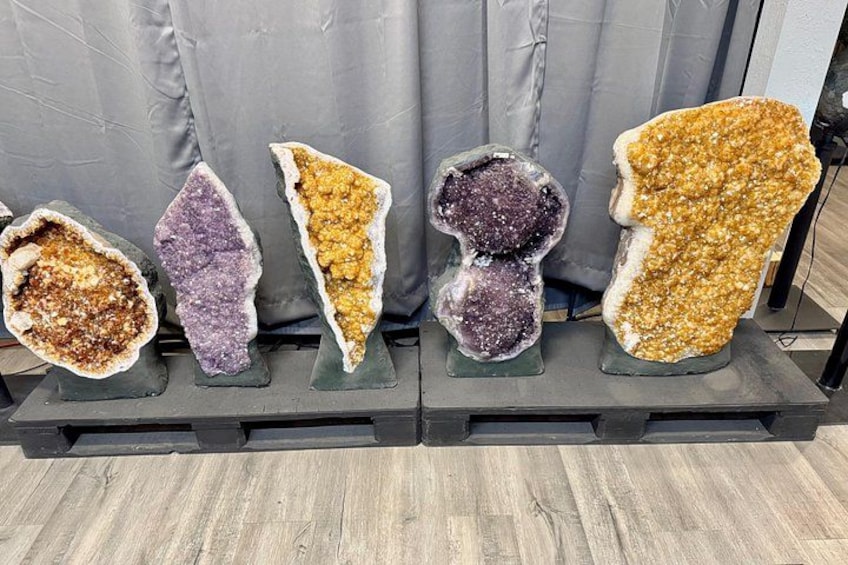 A display of polished geodes with various colors and textures. 5
