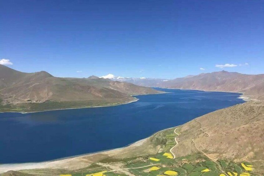 A large body of water surrounded by mountains. 2
