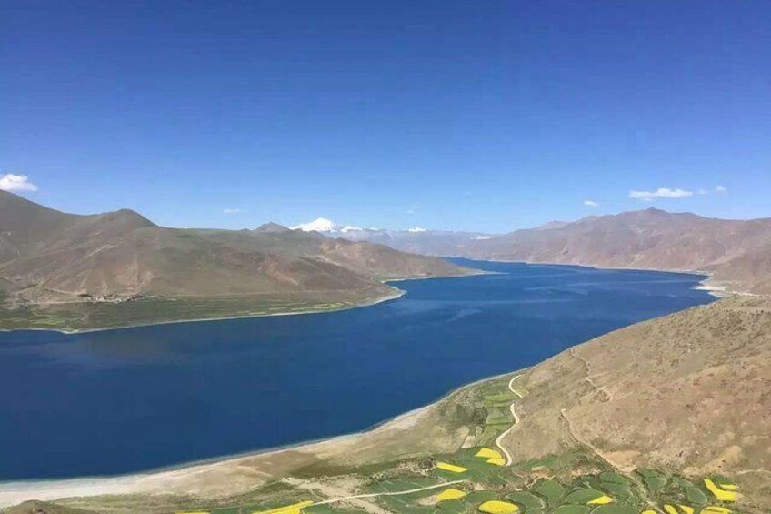 A large body of water surrounded by mountains. 3