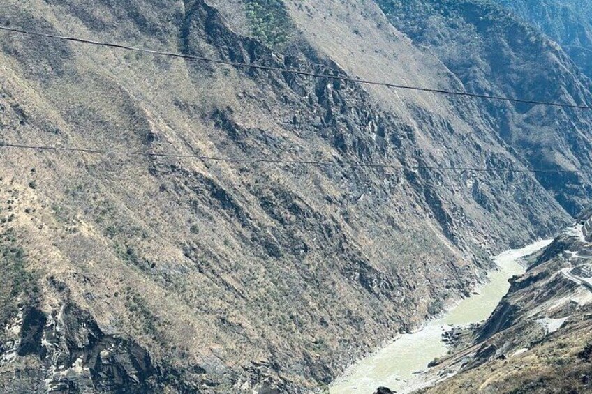 A mountainous landscape with a river flowing through a valley. 5