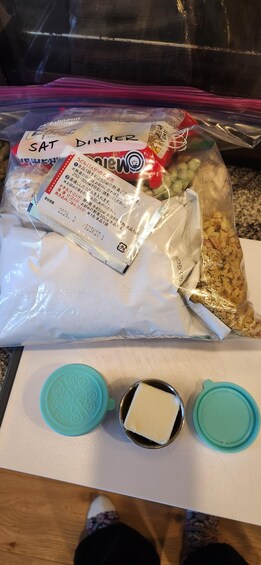 A kitchen counter with food items and kitchenware. 4