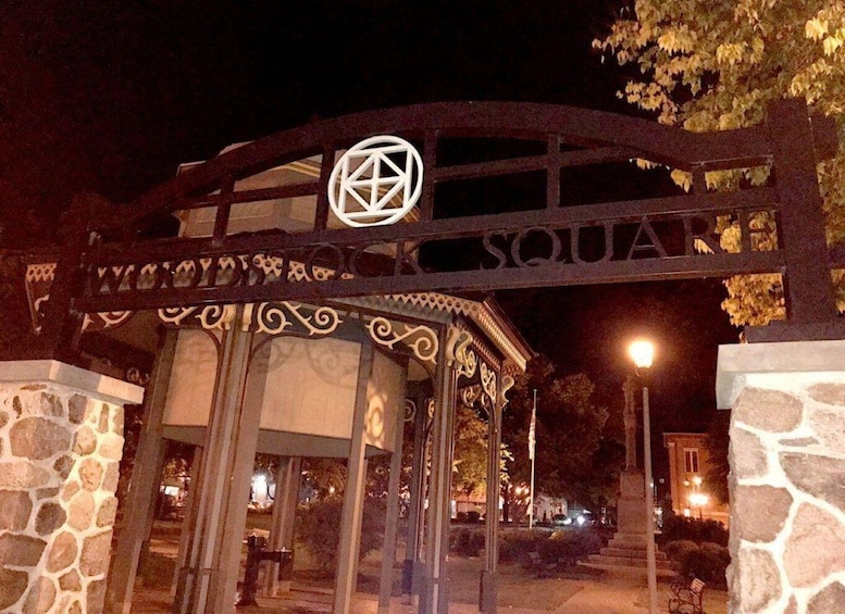 A stone archway with a pentagram symbol and the words 'SQUARE' above it. 3