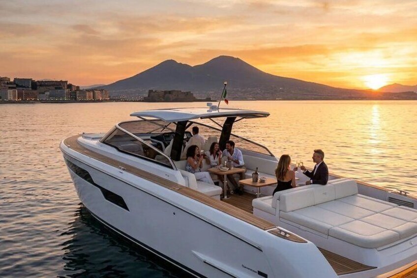 A white yacht with passengers enjoying a sunset on calm waters, with a mountainous backdrop. 1