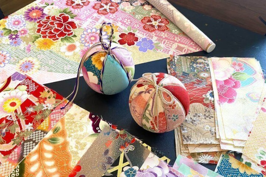 A collection of colorful fabric pieces and two small fabric bags. 1