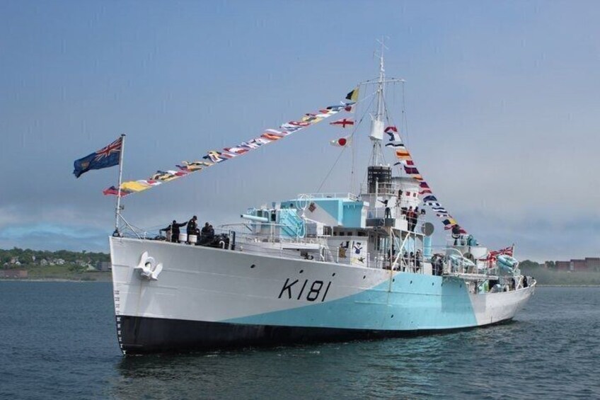 A large fishing vessel with the number K181 on its side, sailing on calm waters. 1